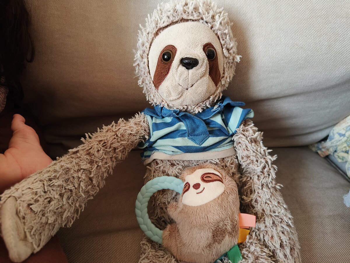 Corn with a baby sloth toy